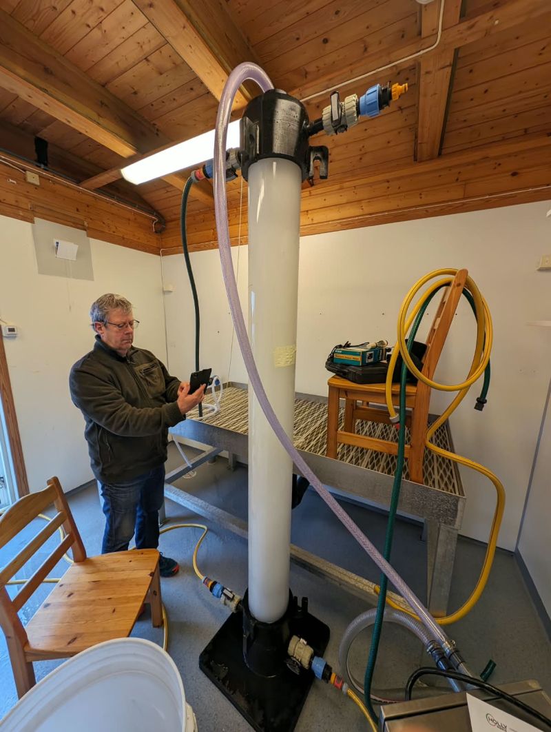 Thorolf Magnesen beside a nanobubble column in the NanoMAR laboratory